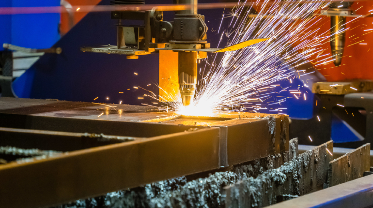 Image of a 3D metal laser cutting machine in action