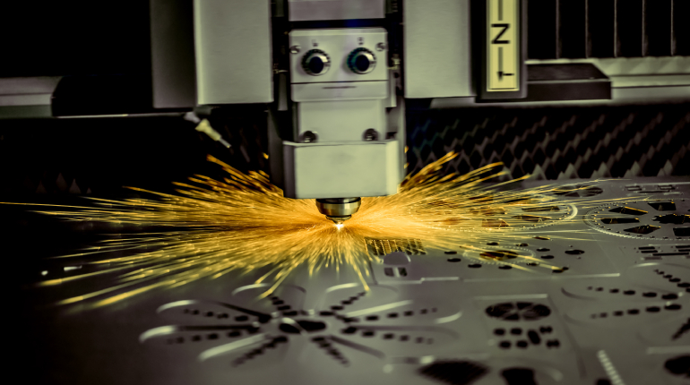 Image of a small laser metal cutting machine in operation